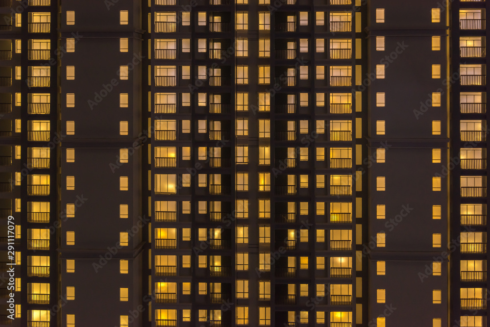 Fototapeta premium Bright yellow light beautiful real estate industry large residential building architectural model facade closeup