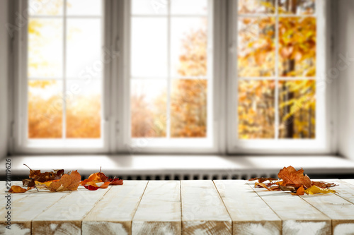Foto Fall wooden window sill and free space for your decoration.