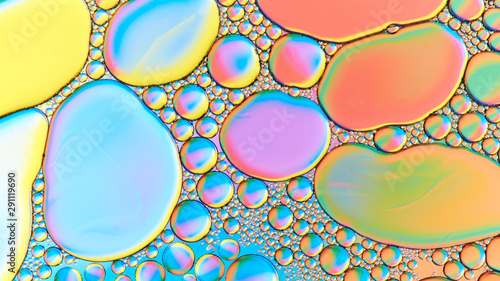 Colorful abstract images of oil drops on water. Colored circles and waves as a concept of scientific discovery, space or molecular research.