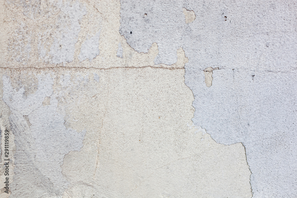 Obraz premium Texture of a concrete wall with cracks and scratches which can be used as a background