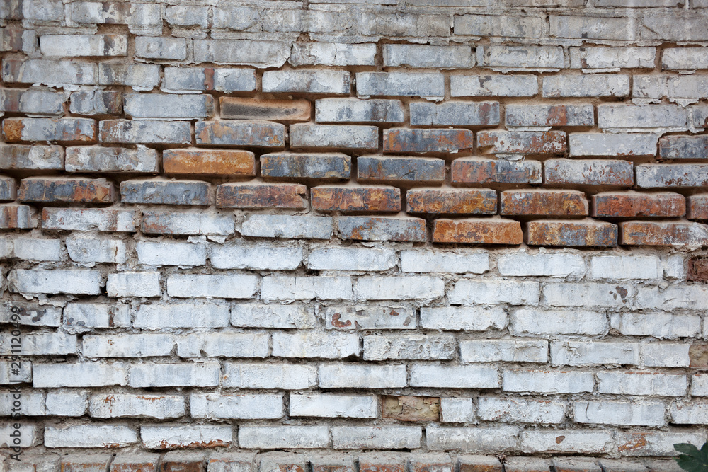 Texture, brick, wall, it can be used as a background . Brick texture with scratches and cracks