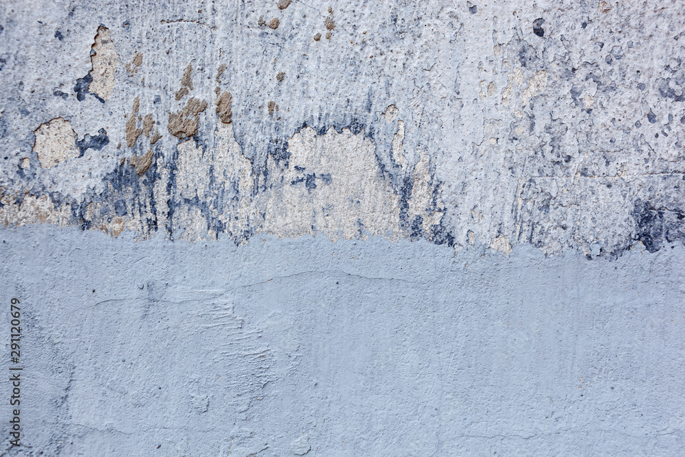Texture of a concrete wall with cracks and scratches which can be used as a background Texture of a concrete wall with cracks and scratches which can be used as a background