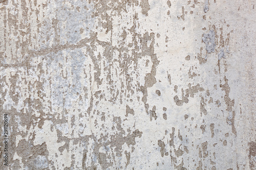 Texture of a concrete wall with cracks and scratches which can be used as a background © supersomik