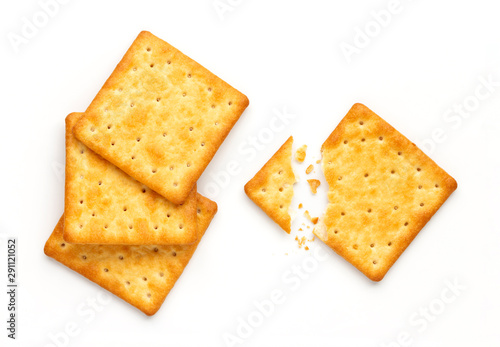 Crushed dry cracker cookies isolated on white background.