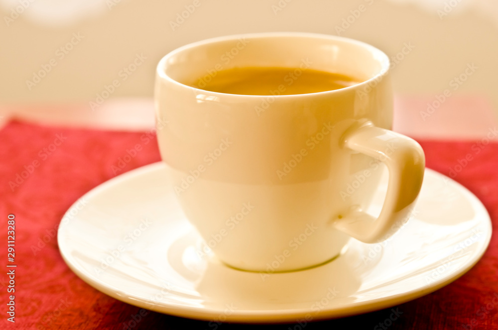 white cup with espresso coffee with beautiful foam on table white cup with espresso coffee with beautiful foam on table