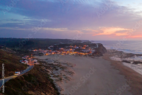 Aerial at Praia Monte Clerigo in Portugal at sunset