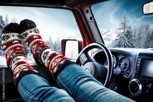Winter car and legs with christmas socks 