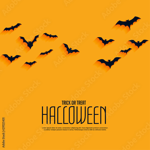 yellow happy halloween background with flying bats