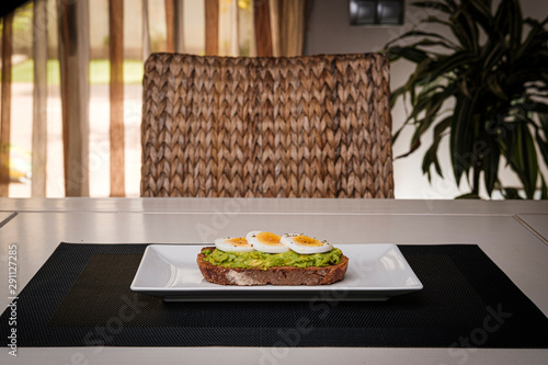 healthy breakfast, advocado toast with eggs and orange juice