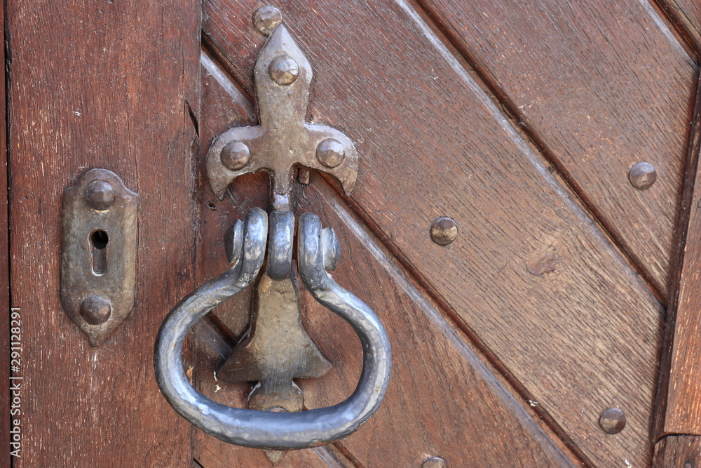 Old wooden door with metal lock