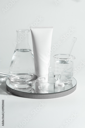 beauty spa medical skincare and cosmetic lotion bottle cream packaging product on white decor background and laboratory test glass tube in doctor healthy science concept
