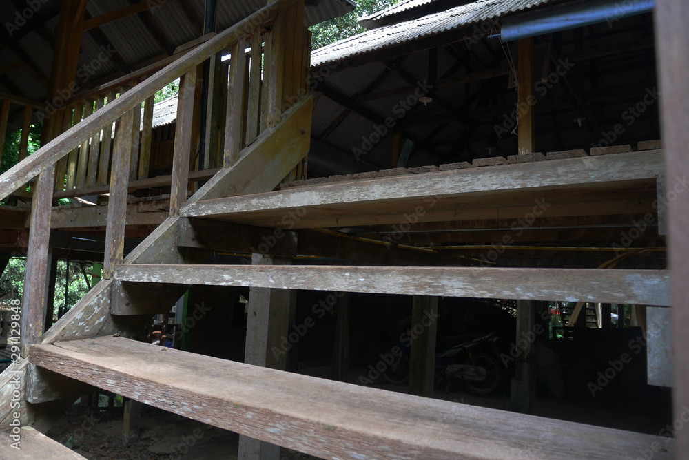 Traditional Exterior wood ladder of Thai country house.