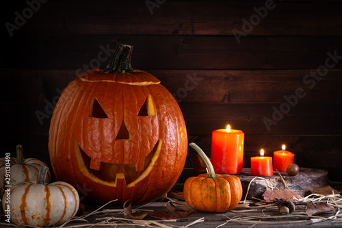 Jack-O-Lantern With Pumpkins and Candles