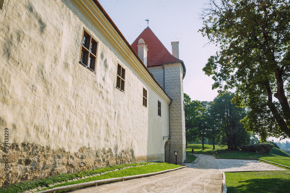 Fototapeta premium City Bauska, Latvia Republic. Park with old castle. Trees and green zone. Sep 9. 2019 Travel photo.