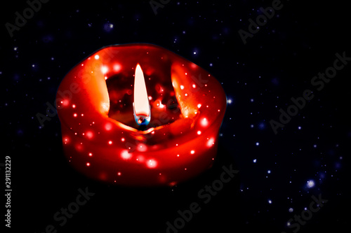 Sticker Red holiday candle on dark sparkling snowing background, luxury branding design