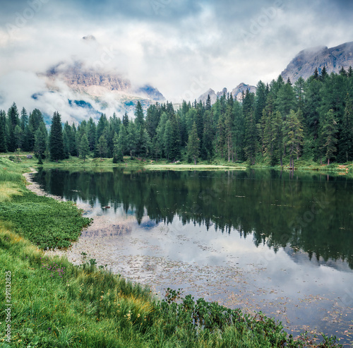 Marvelous summer scene of Antorno lake with Tre Cime di Lavaredo  Drei Zinnen  mount in the morning mist. Splendid summer view of Dolomite Alps  Italy  Europe. Beauty of nature concept background.