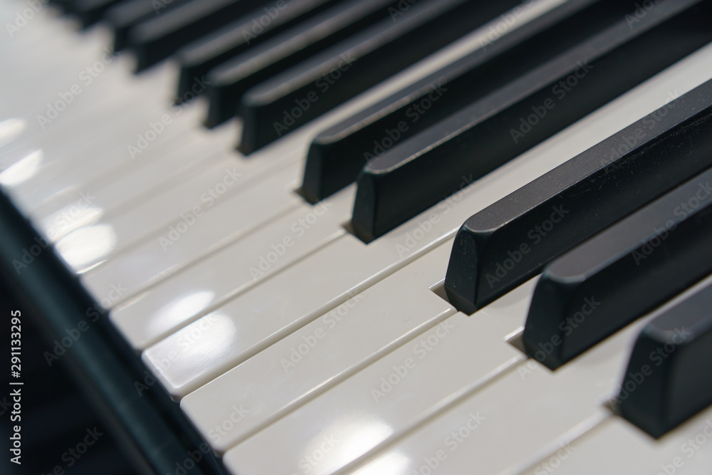 Photography of black and white piano keys. Close frontal view. Photography of black and white piano keys. Close frontal view.
