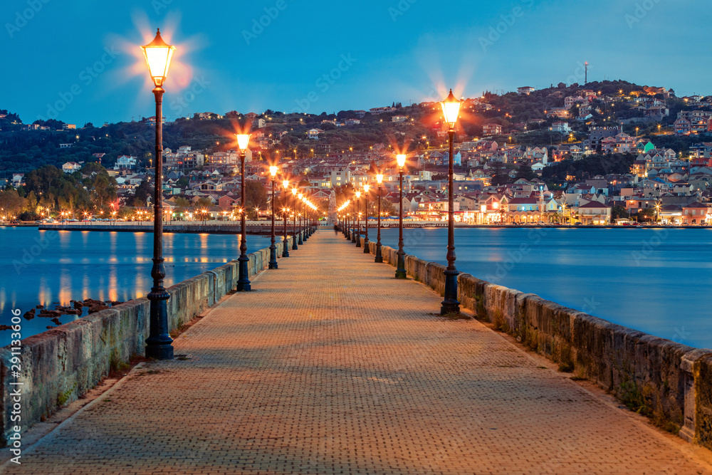 Fabulous evening cityscape of Argostolion town, former municipality on the island of Kefalonia, Ionian Islands, Greece. Gorgeous spring seascape of Ionian Sea. Traveling concept background.
