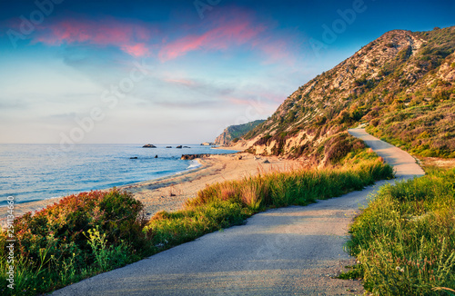 Fabulous spring sunset view of Avali Beach. Colorful evening seascape of Ionian sea. Fantastic outdoor scene of Lefkada Island, Greece, Europe. Beauty of nature concept background. photo