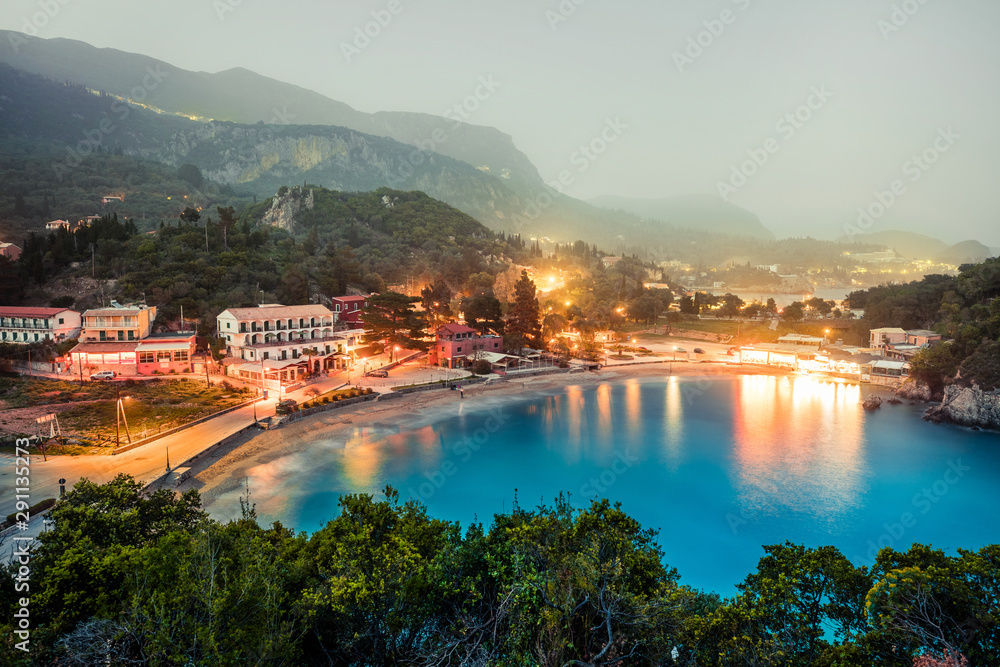 Fantastic evening scene of Palaiokastritsa village, Corfu, Ionian Islands, Greece, Europe. Incredible spring seascape of Ionian Sea. Traveling concept background. Instagram filter toned.