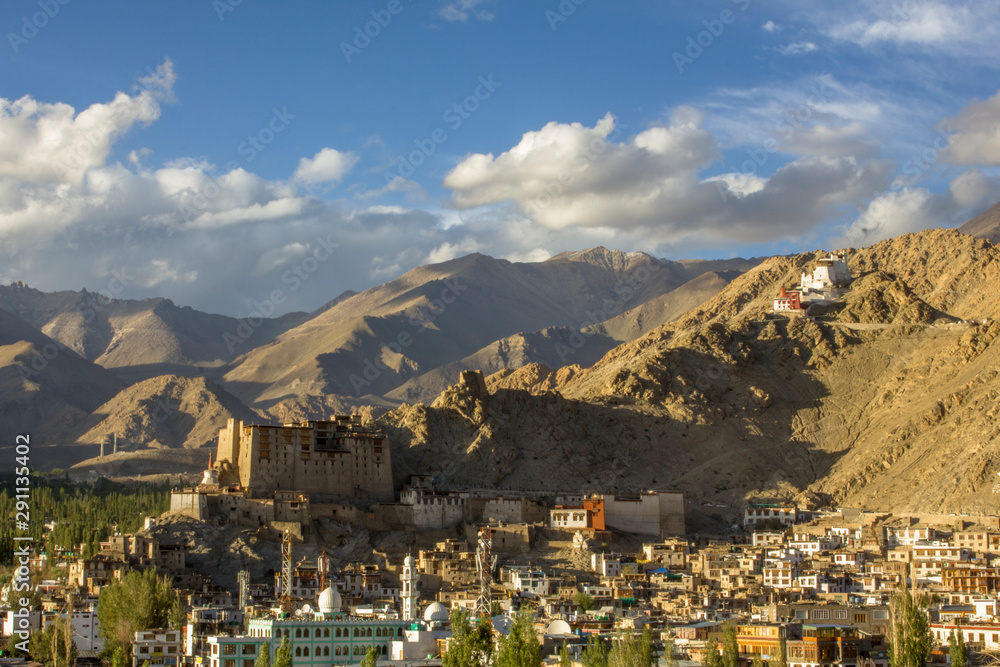 ancient Tibetan palace and Buddhist temple on the mountain above the city in the mountain valley ancient Tibetan palace and Buddhist temple on the mountain above the city in the mountain valley