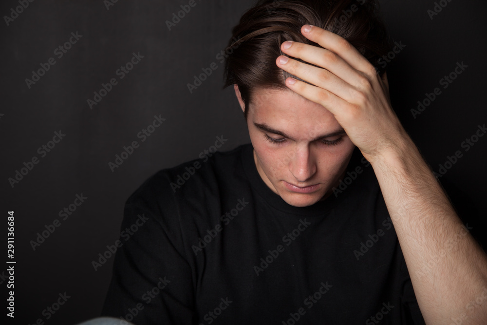 Worried young man or teen feeling overwhelmed Worried young man or teen feeling overwhelmed