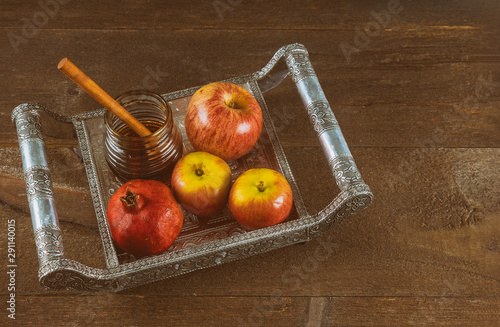 Honey, apple and pomegranate traditional holiday symbols rosh hashanah jewesh holiday photo