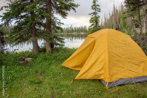 Camping in the Mountains in Yellow Tent