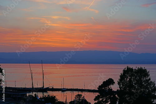 Colorful sunset sky over Lake Geneva in Evian-les-Bains, Haute-Savoie, France photo