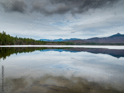 Chocorua Lake during April Spring time with a reflection view photo