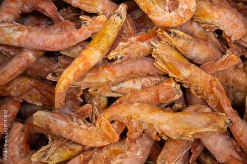 Seafood shrimps, prawns in pile as background for recepies, menu or food industry