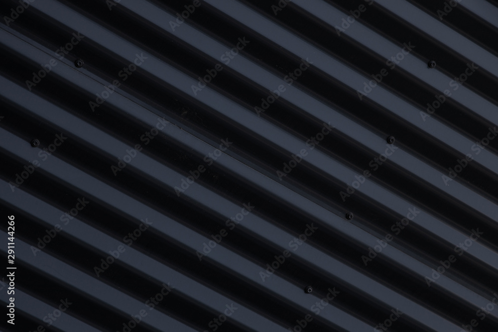 Obraz premium Close-up of metal shiny black corrugated surface