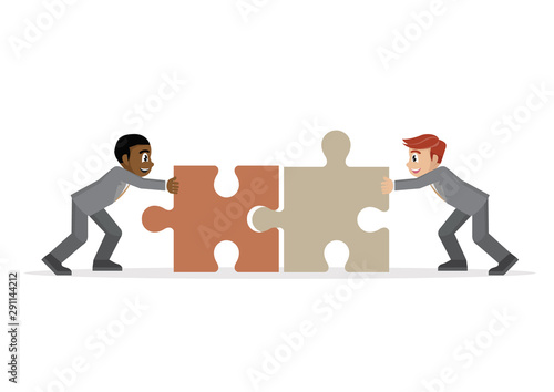 Businessman pushing two jigsaw pieces together.