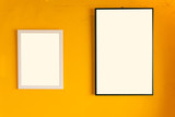 Close-Up Of Blank Picture Frame On Yellow Wall.blank frame on the wall