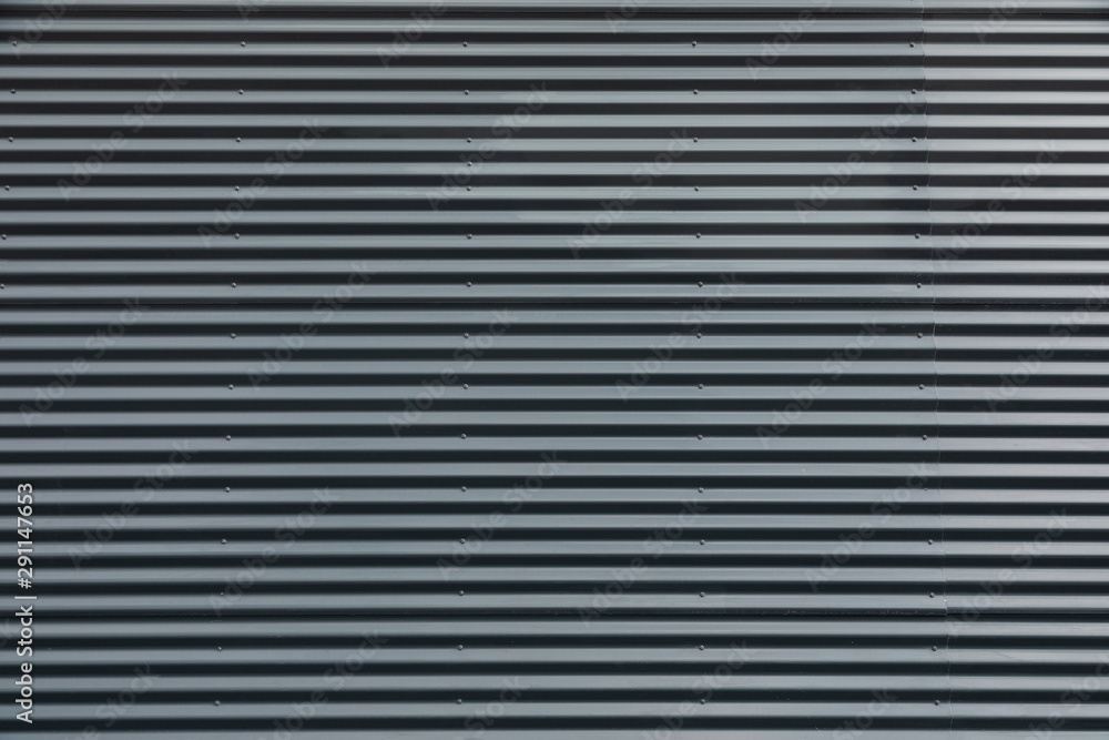 Obraz premium Ribbed metal wall of a modern building