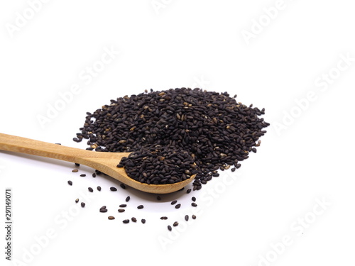  Black sesame in wooden spoon isolated on white background.  