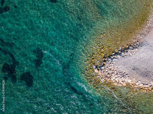 Aerial view of Sveti Nikola  Budva island  Montenegro. Jagged coasts with sheer cliffs overlooking the transparent sea. Wild nature and Mediterranean maquis