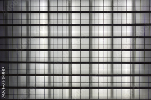 Steel frame black and white grid background glowing pattern