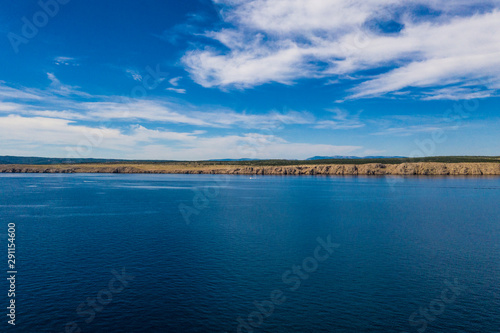 Panoramic view of Krk Island in Croatia with beautiful sea and sunny summer sky  © Mislav