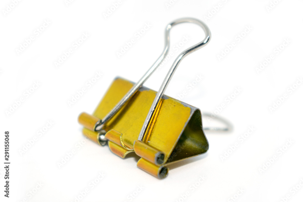 Photo of a yellow paper clip. Photo of a yellow paper clip.