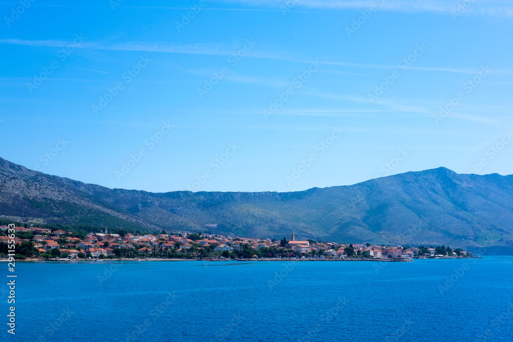 A picturesque Orebic city in Peljesac island, Dalmatia, Croatia, view from ferry on sunny day 