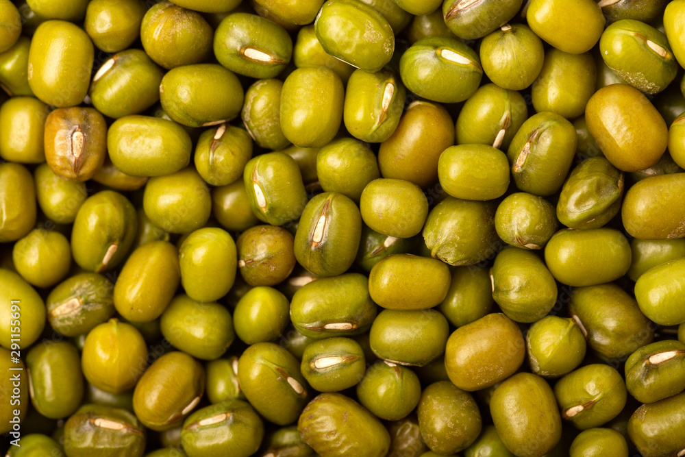 Closeup top view image of green mung beans as healthy food background. Closeup top view image of green mung beans as healthy food background.