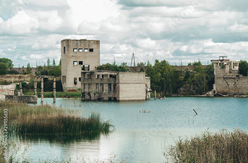 Abandoned sunken ruins prison in Rummu quarry, Estonia. photo