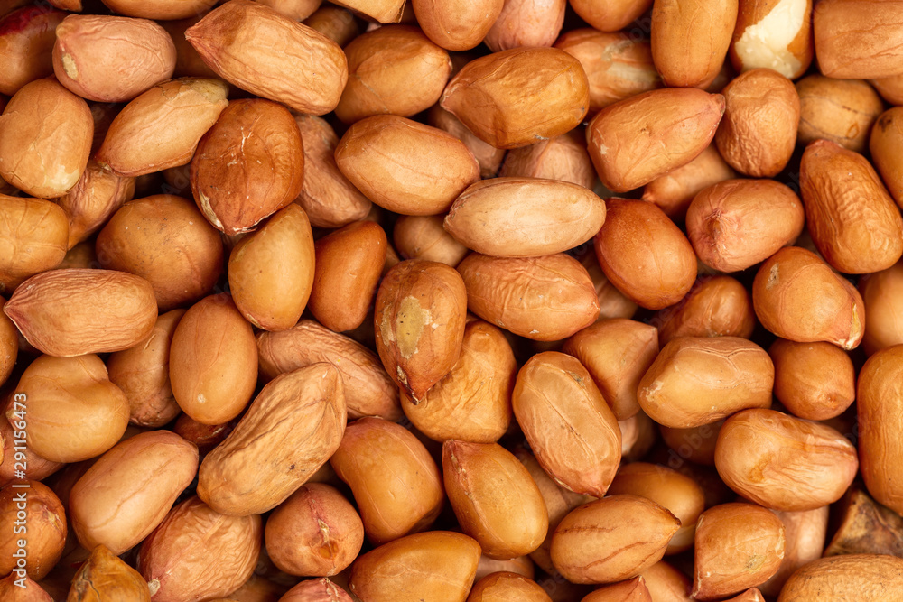Macro flatlay image of salted peanuts as a food background. Macro flatlay image of salted peanuts as a food background.