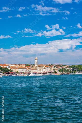 Panoramic view of Krk town with blue Adriatic Sea and boats on sunny summer day, Krk Island in Croatia © Mislav