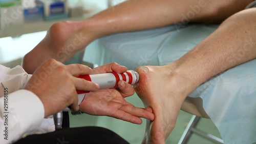 Heel treatment procedure with Shock Wave Therapy.Close up