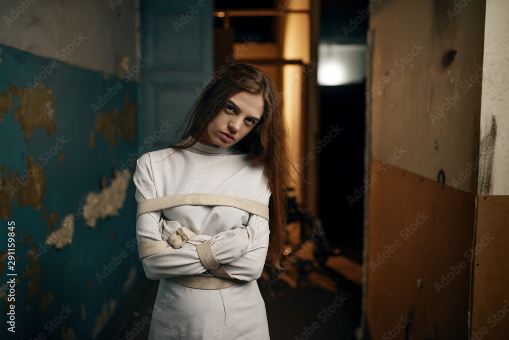 Female patient in strait jacket, mental hospital