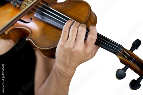 Hand of a female violinist on the fingerboard of a violin isolated on white