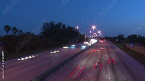 Interstate 95 at 48th Street in Deerfield Beach, Florida After Dusk in Twilight with Cars Creating Short Streaks in a Slow Shutter-Speed Time-Lapse