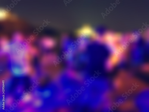 Abstract silhouettes of dancing people with strobe lights and multicolored highlights with bokeh and blur effect, disco with social dancing outdoors